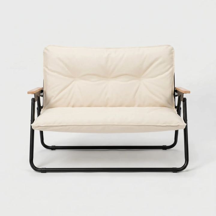 Two-person portable camping sofa, perfect for comfortable outdoor seating at campsites. Durable folding couch.
