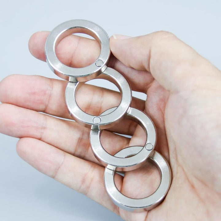 Compact folding fidget ring, a portable stress reducer & focus aid. Perfect desk accessory for calm.
