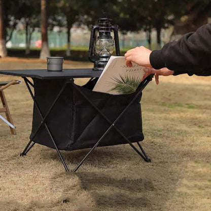 Foldable aluminum picnic table with storage, designed for easy transport and outdoor use