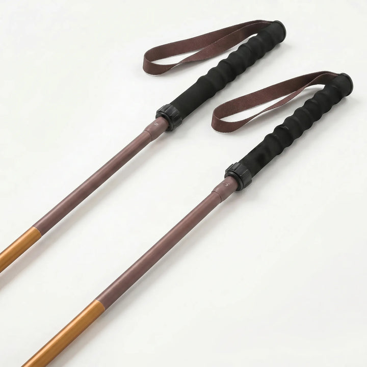Compact folding trekking pole for hiking, easy to pack lightweight outdoor gear with quick lock system.