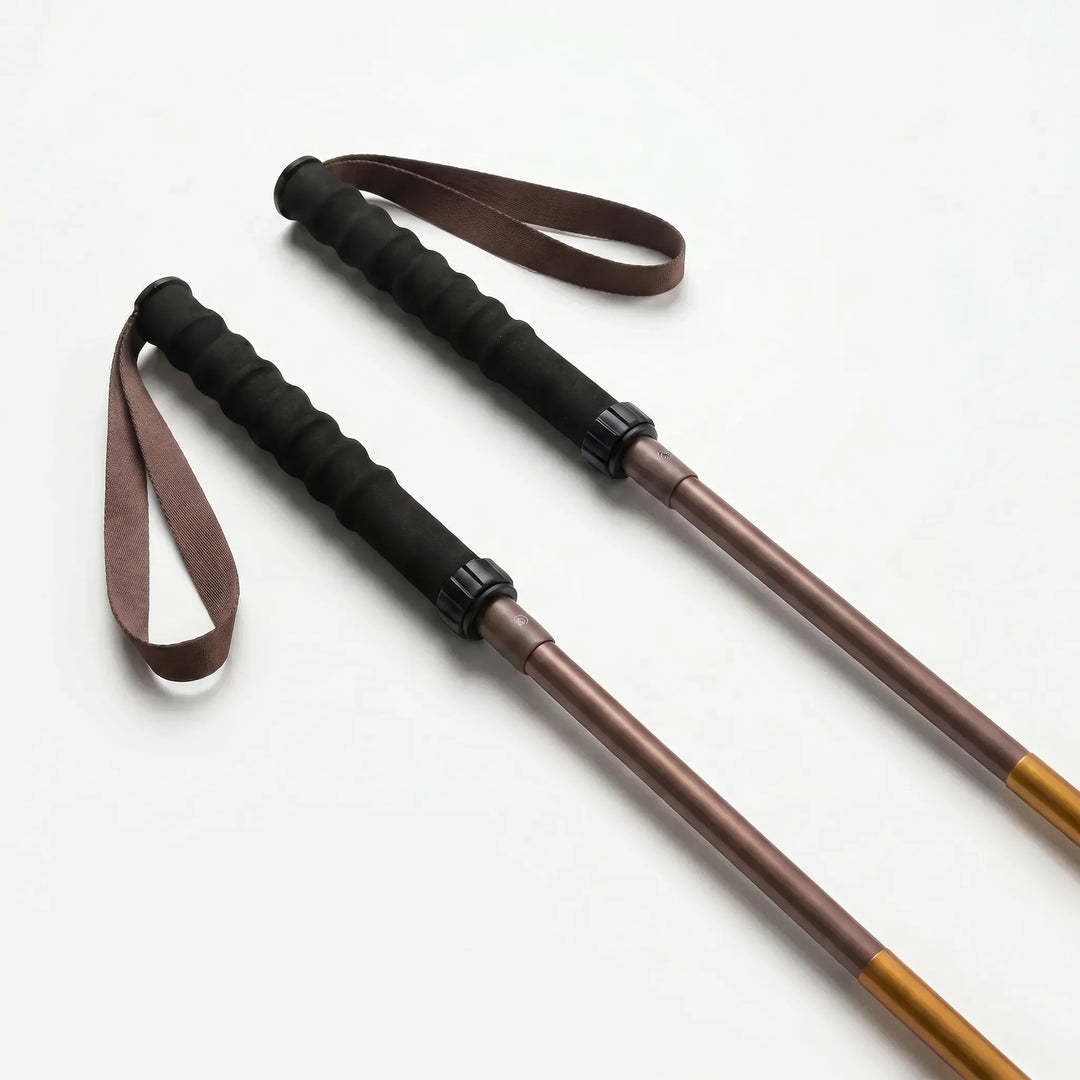 Comfortable foam grip on a unisex folding trekking pole, quick lock system for secure hiking & trail support.