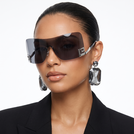 Unisex frameless futuristic sunglasses with UV400 protection. Statement eyewear for festivals & travel.