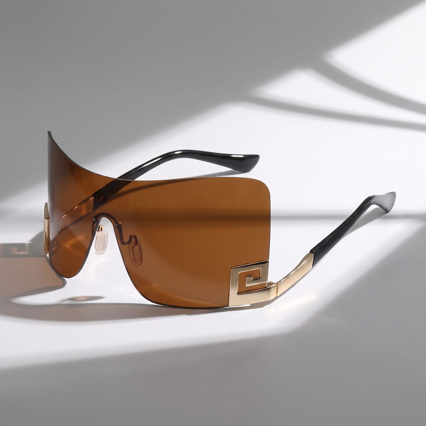 Sleek, frameless futuristic sunglasses for men & women. UV400 polycarbonate lenses provide essential eye protection.