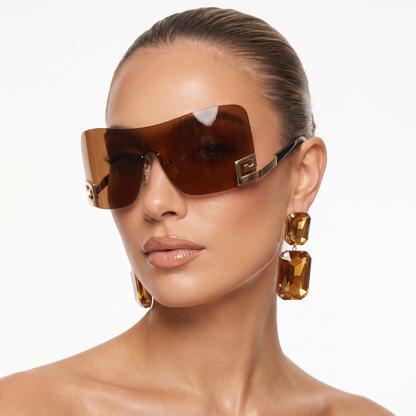 Statement unisex futuristic frameless sunglasses, offering UV400 protection. Perfect unique festival eyewear.