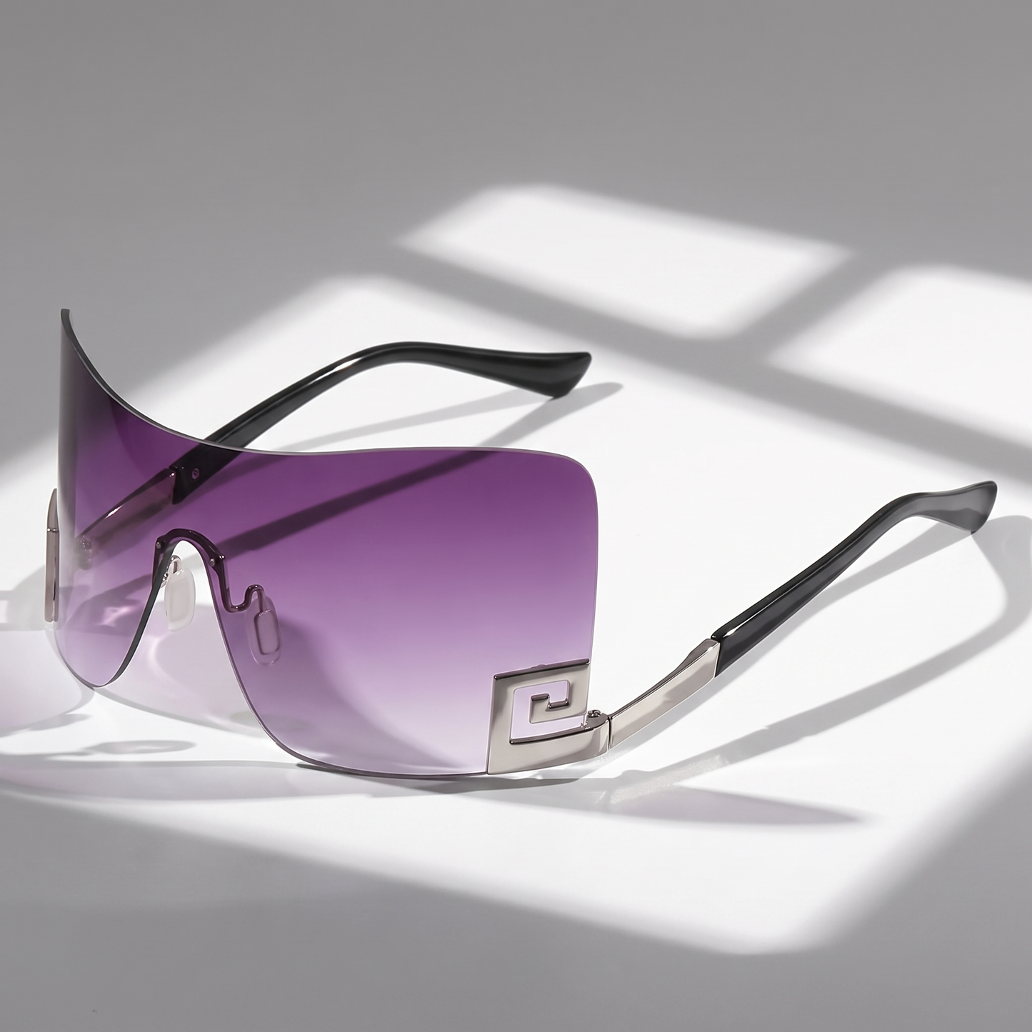 Unisex frameless futuristic sunglasses with UV400 protection. Versatile statement eyewear for travel & festivals.