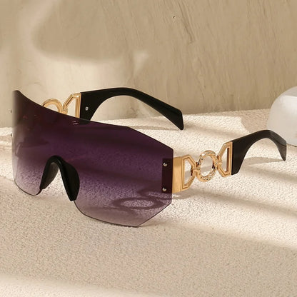 Futuristic frameless sunglasses, unisex, featuring sleek gold temples & gradient lenses. Offers UV400 protection.
