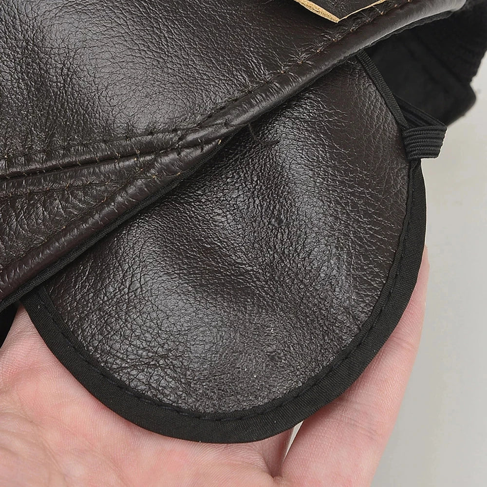 Front view of a stylish unisex genuine leather cap with warm fleece lining. A classic adjustable winter hat accessory.