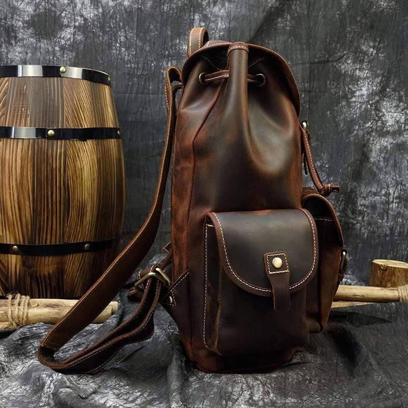Rugged men's genuine leather backpack with ample storage for hiking gear, close-up