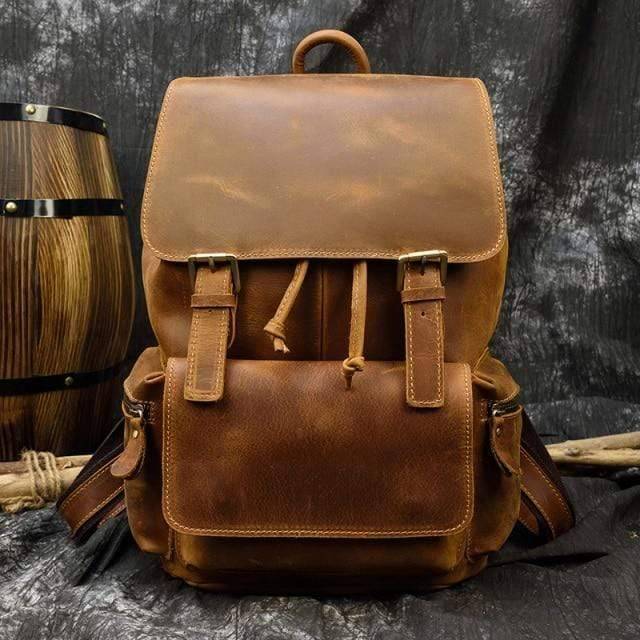 Unisex genuine leather rucksack showing straps and buckle details, heavy-duty design