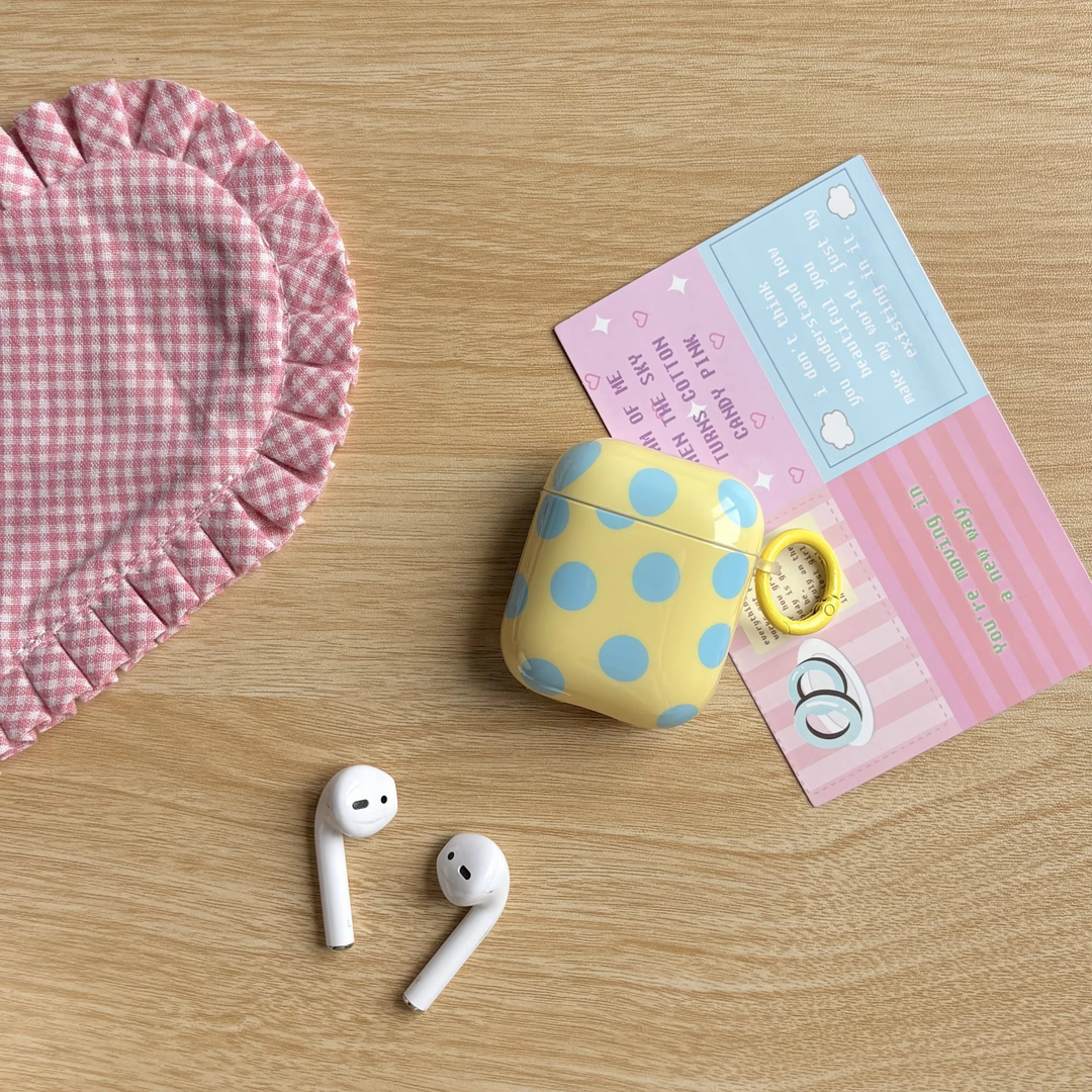 Unisex glossy polka dot earphone case with a convenient ring cover for wireless earbuds.