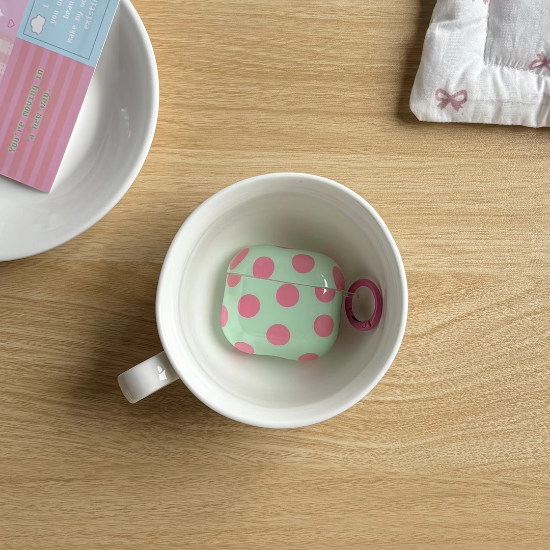 Stylish tech accessory: Unisex glossy polka dot earphone case with secure ring cover for wireless earbuds.