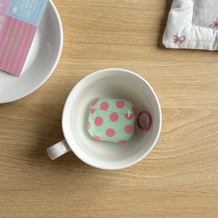 Stylish tech accessory: Unisex glossy polka dot earphone case with secure ring cover for wireless earbuds.