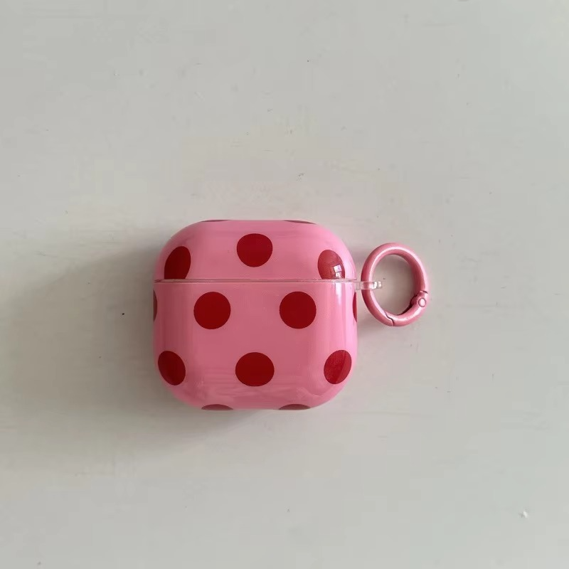 Secure & stylish: Glossy polka dot earphone case with integrated ring cover for easy portability of earbuds.