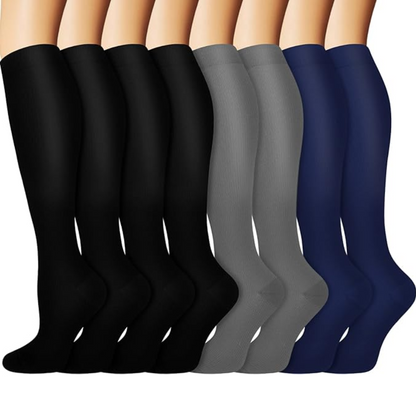 Man wearing black gradual compression socks (15-20mmHg) for athletic recovery & improved circulation.