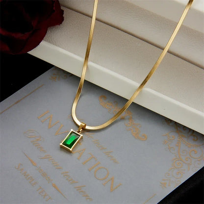 Unisex green stone & gold stainless steel jewelry set, featuring necklace and earrings. Elegant fashion gift.