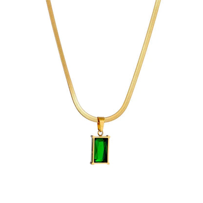 Stylish gold stainless steel earrings with vibrant green stones, part of a unisex jewelry set.