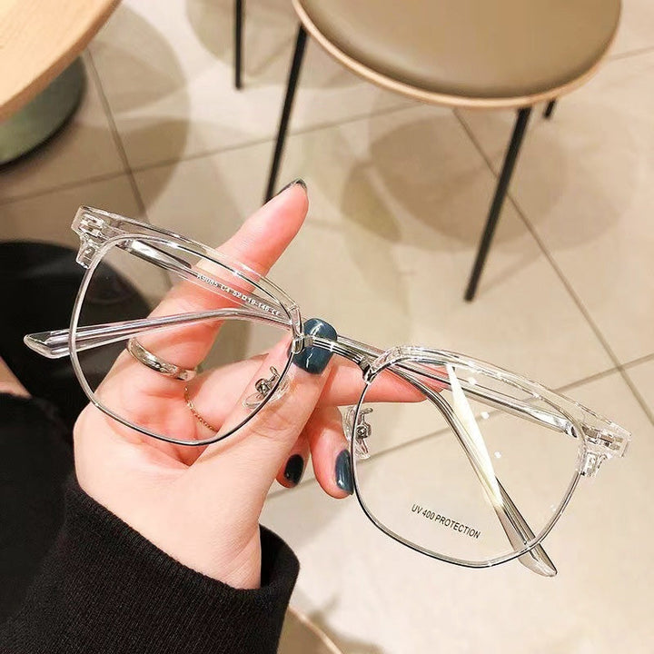 Blue light blocking half-rim glasses, reducing digital eye strain for improved vision and comfort.