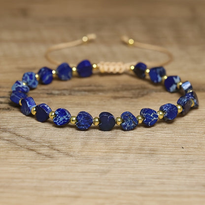 Adjustable beaded bracelet featuring colorful natural gemstones and a unique heart design, unisex.