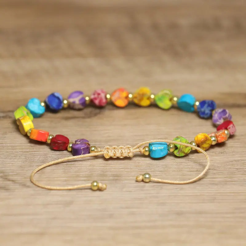 Colorful natural gemstone beaded bracelet with a heart accent, adjustable for a perfect fit, unisex.