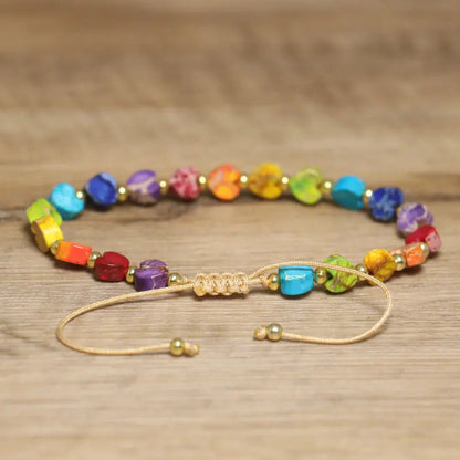 Colorful natural gemstone beaded bracelet with a heart accent, adjustable for a perfect fit, unisex.