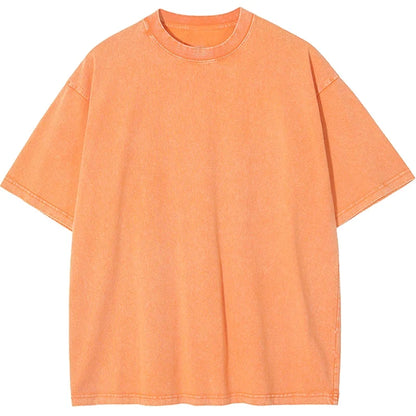 Model wearing a relaxed fit, heavyweight unisex t-shirt, showcasing its retro style and boxy cut. Garment dyed.