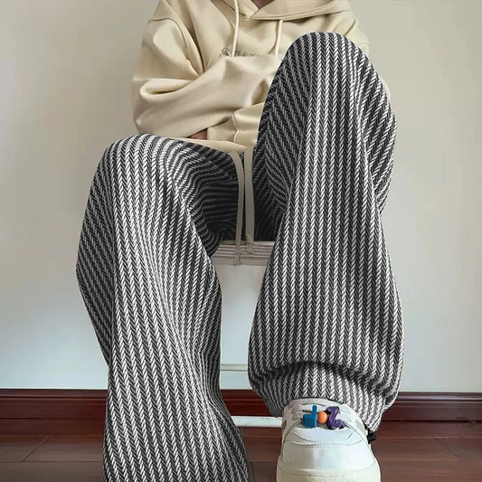Unisex herringbone relaxed fit sweatpants with wide leg & drawstring waist, perfect for comfortable casual wear.