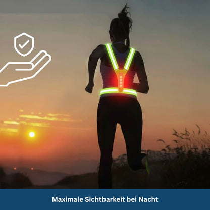 Close-up of a neon yellow high visibility safety vest featuring flashing LED lights for enhanced outdoor safety
