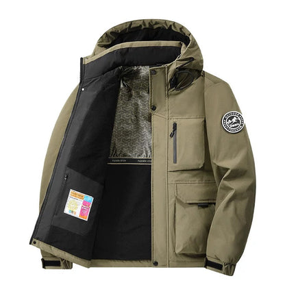 Model wearing a practical unisex hooded waterproof coat. Stay dry & warm in this modern fall & winter jacket.