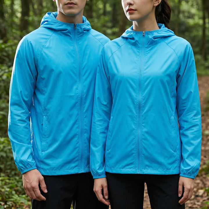 Unisex hooded windbreaker, perfect travel jacket. Lightweight & water-resistant for hiking, fishing & outdoor trails.