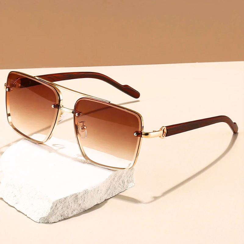 Horizon unisex sunglasses with blue UV400 lenses and golden frames. Essential eyewear for sun protection & style.