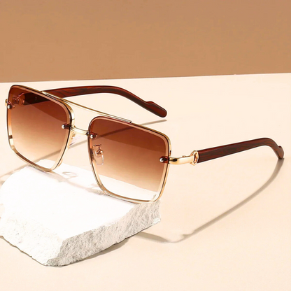 Horizon unisex sunglasses with blue UV400 lenses and golden frames. Essential eyewear for sun protection & style.