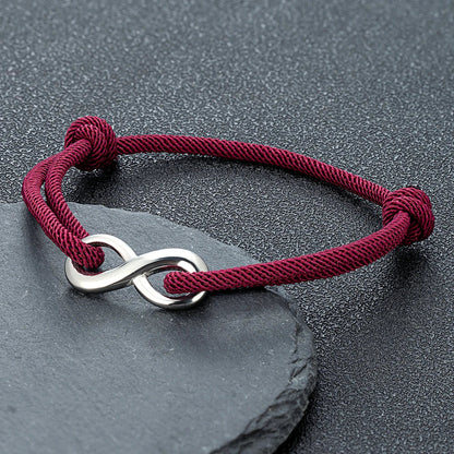 Minimalist infinity symbol cord bracelet, unisex, adjustable, perfect for everyday symbolic wear.