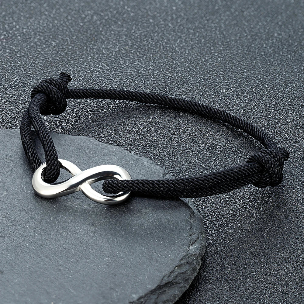 Durable stainless steel infinity charm on an adjustable braided cord bracelet for men & women.