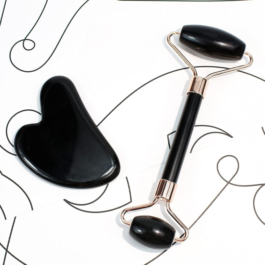 Green jade Gua Sha and roller skincare tools for a refreshing face massage & glowing skin.