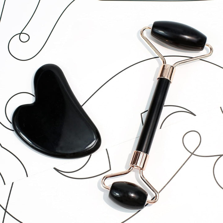 Green jade Gua Sha and roller skincare tools for a refreshing face massage & glowing skin.