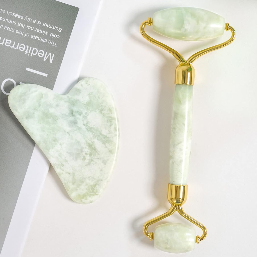 Close-up of the natural jade stone Gua Sha and facial roller, highlighting quality & design.