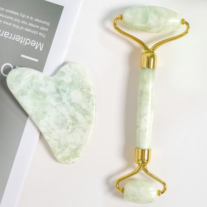 Close-up of the natural jade stone Gua Sha and facial roller, highlighting quality & design.