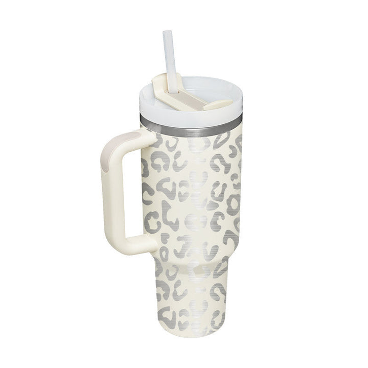 Insulated travel coffee mug with a comfortable handle & spill-resistant straw. Stay refreshed.