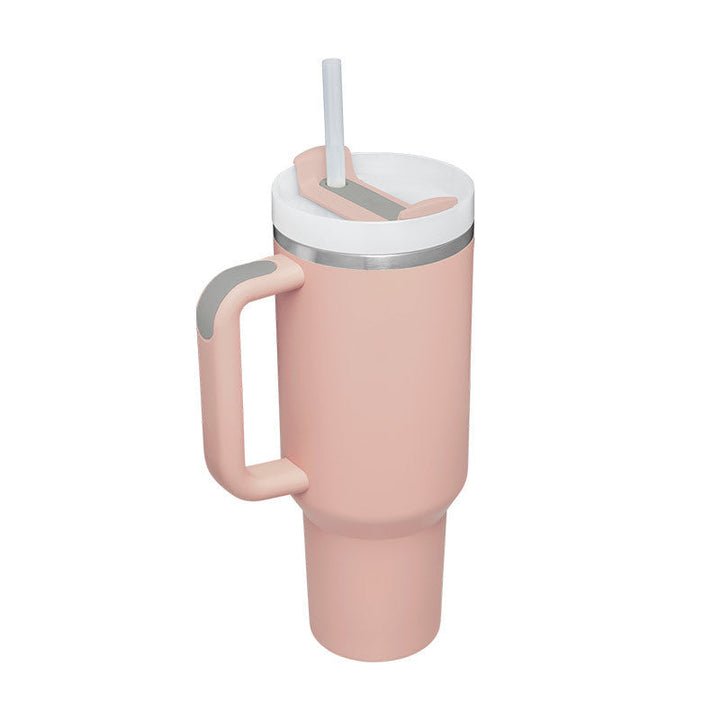 Insulated travel mug with handle & straw, designed for durability and portability.