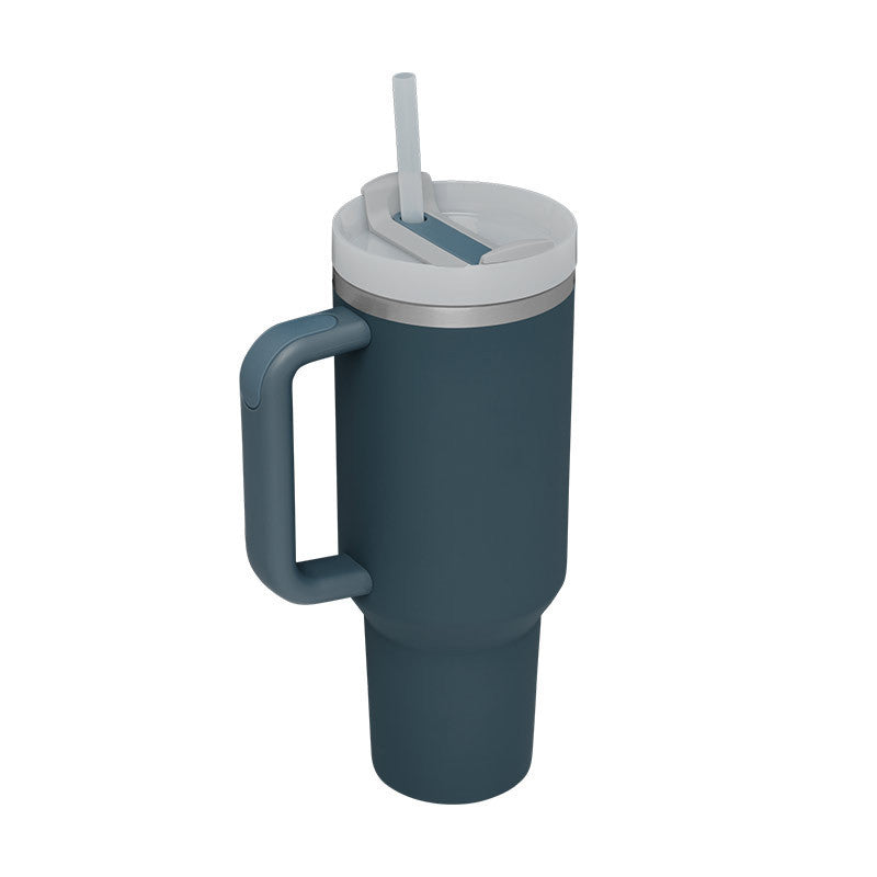 Insulated travel mug with handle & straw for optimal temperature retention. Perfect for any drink.