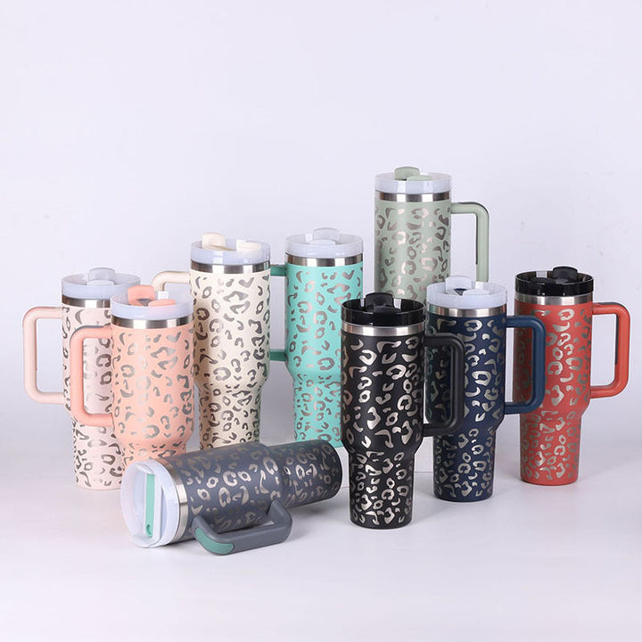 Insulated tumbler with handle & straw, ideal for hot coffee or cold water. Portable & reusable drinkware.