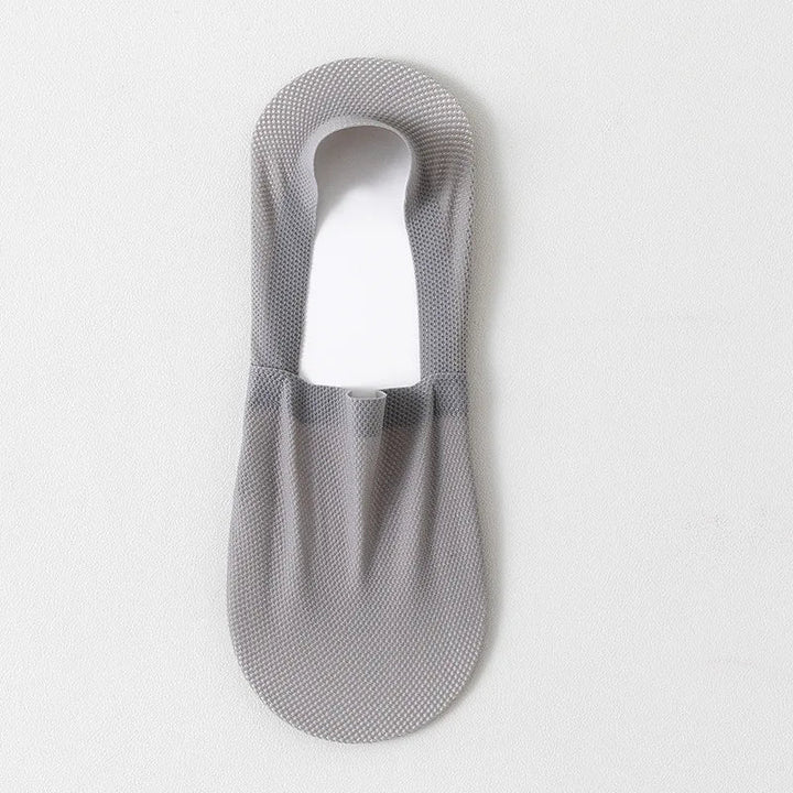Soft, breathable unisex no-show socks with reinforced anti-slip heel, invisible under shoes.