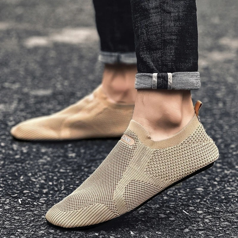 Interior of a breathable unisex knit slip-on shoe, designed for lightweight barefoot comfort and easy wear.