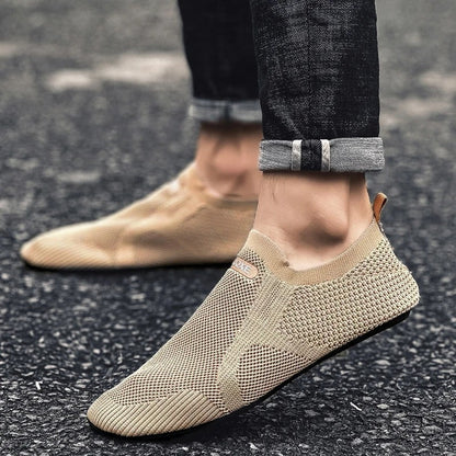 Interior of a breathable unisex knit slip-on shoe, designed for lightweight barefoot comfort and easy wear.