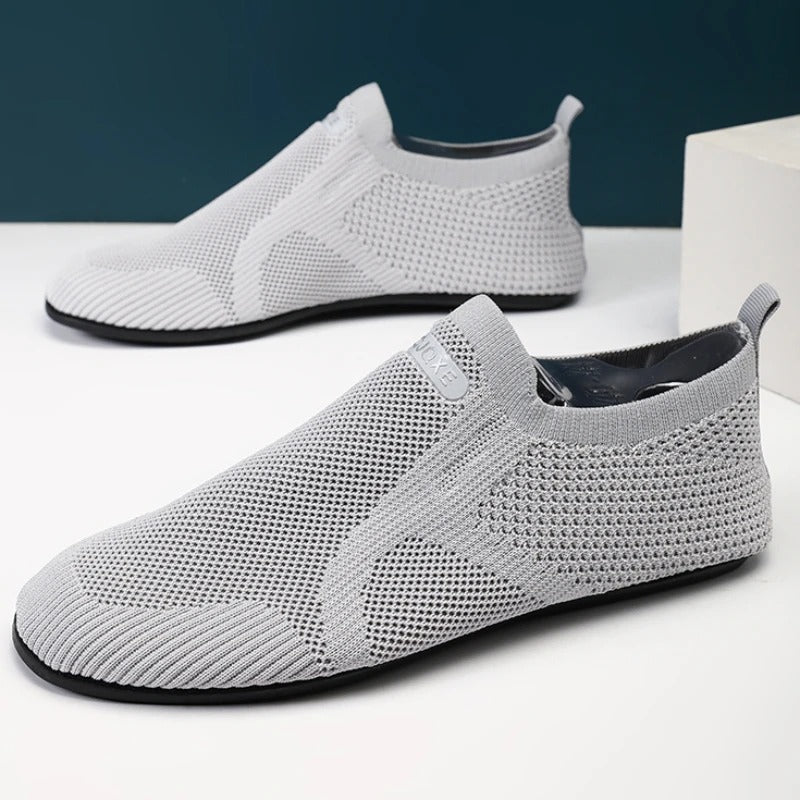 Close-up of the flexible, non-slip sole on unisex knit barefoot slip-on shoes for walking comfort.