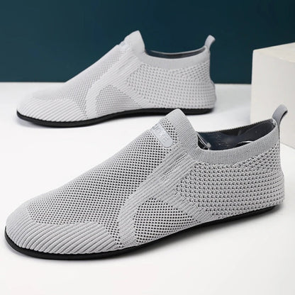 Close-up of the flexible, non-slip sole on unisex knit barefoot slip-on shoes for walking comfort.