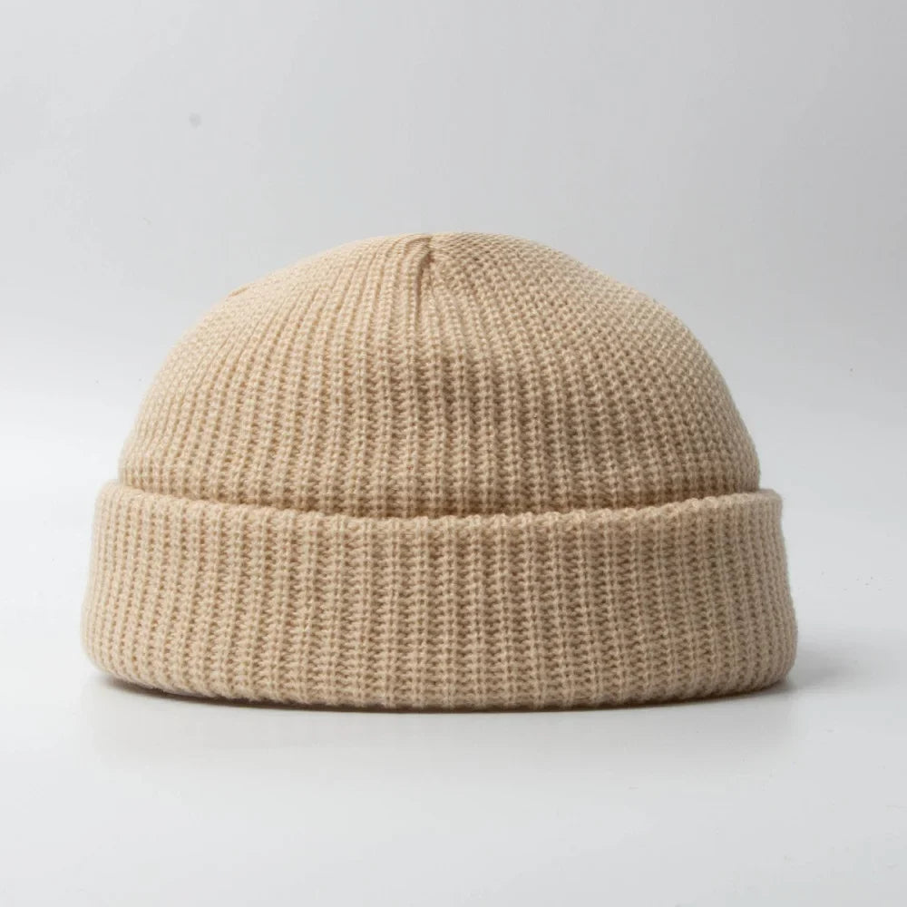 Unisex knitted skull cap beanie hat, perfect for winter warmth & comfort. Soft cotton blend headwear accessory.