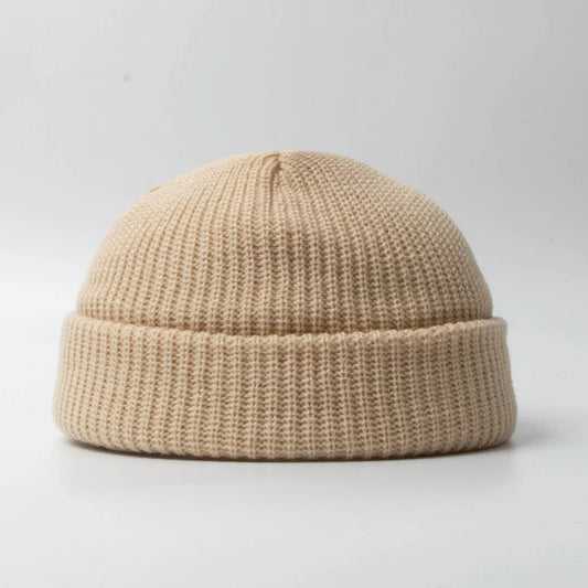 Unisex knitted skull cap beanie hat, perfect for winter warmth & comfort. Soft cotton blend headwear accessory.