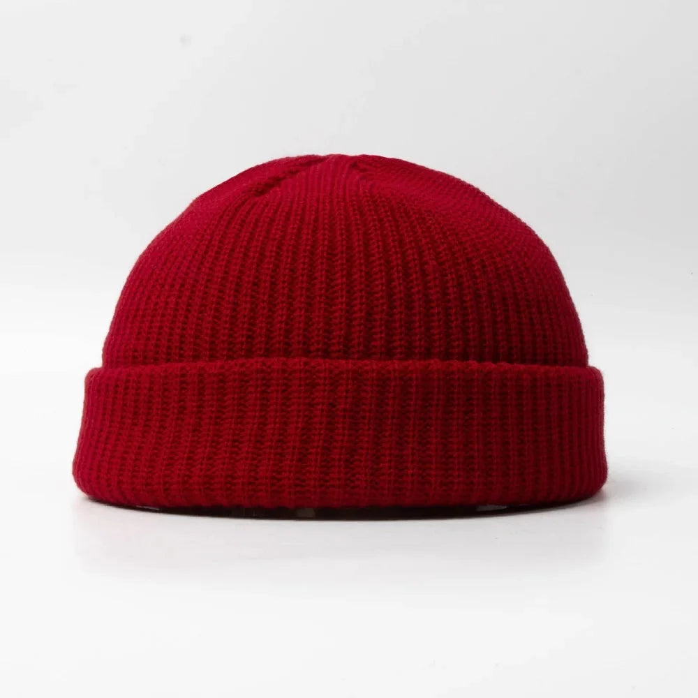 Unisex knitted skull cap, a warm beanie hat for winter. Soft cotton blend headwear accessory.