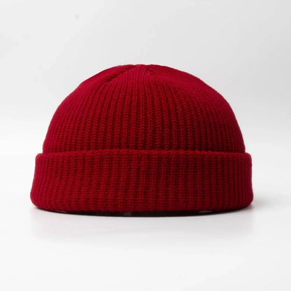 Unisex knitted skull cap, a warm beanie hat for winter. Soft cotton blend headwear accessory.